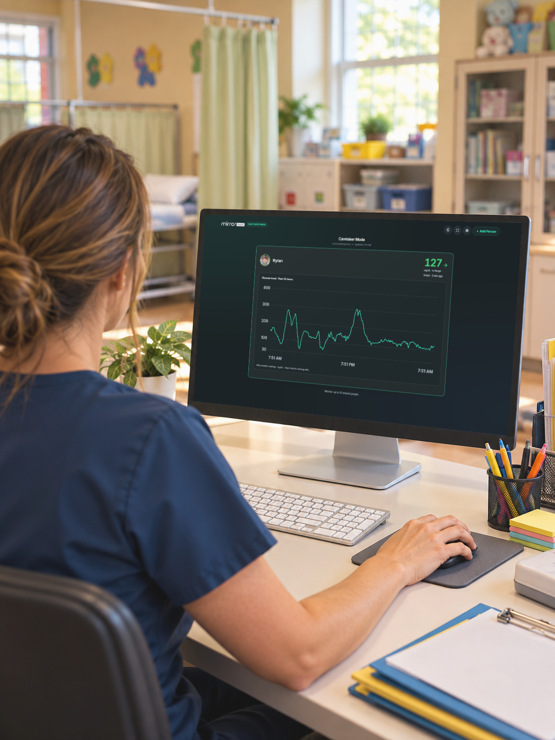 A nurse viewing shared glucose readings and a trend graph in the Mirror Health Caretaker Portal